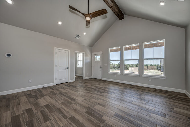Great room in a new construction home with wide windows