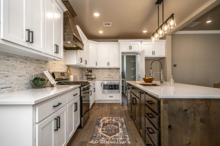 custom home kitchen with wood accents and white cabinetry