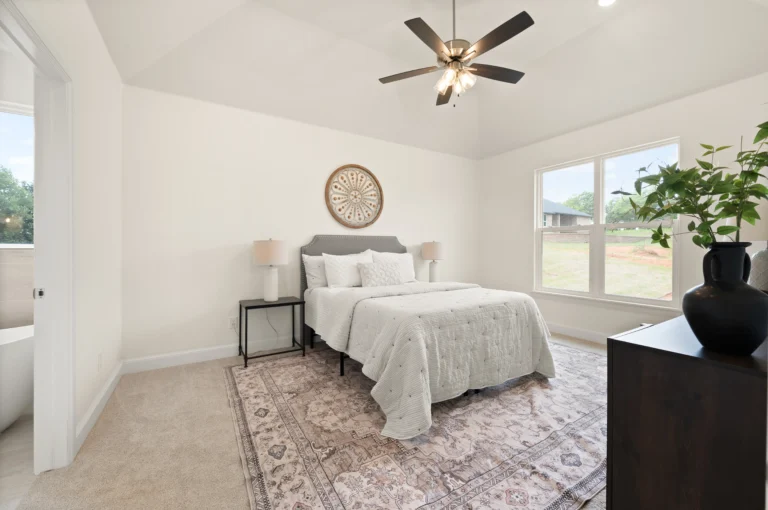 New construction bedroom with a window view